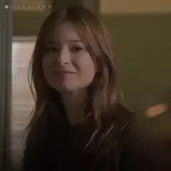 Girl looks in the mirror