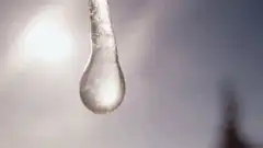 Close-up of a water droplet on a metal surface