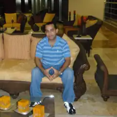 man sitting on couch in living room