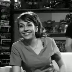 Girl laughing and waving