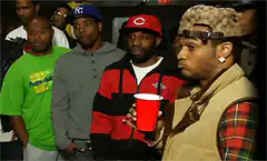 T-Pain looking around with a red cup