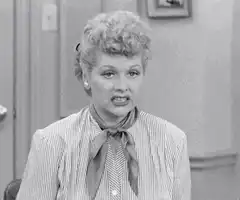 Lucy Ricardo grimacing and laughing