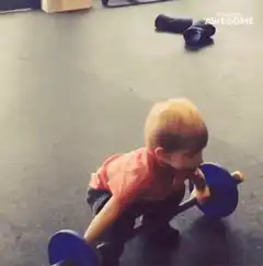 Toddler lifting weights