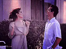 Woman arguing with man outside