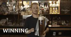 Barman pointing with winning beer