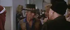 Man kisses woman and she reacts with shock