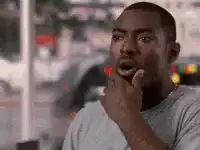 Black man looking shocked and turning around