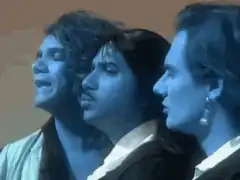 Three men singing in profile