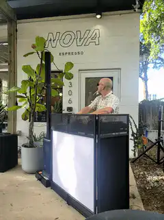 DJ man puts on sunglasses and points