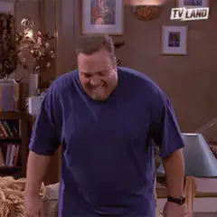 Dre sitting down laughing