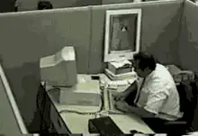 Man smashes computer monitor with baseball bat