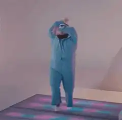 Man in blue onesie dancing