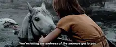 Princess Leia talking to a white horse