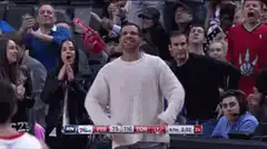 Man in white sweater cheering LET'S GO