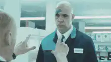 Bald man with blue mark on head