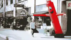 Woman hit by inflatable tube man