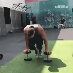 man doing dumbbell pushups