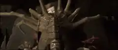 Alien creature behind red-faced woman
