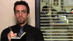 Bert Yancy writing in a notepad
