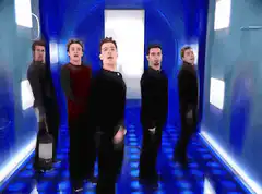 Five men in a blue corridor