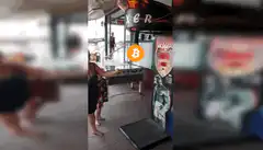 Woman playing air hockey with Bitcoin overlay