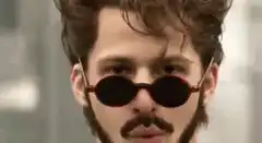 Two men in sunglasses high five
