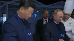 Putin and Xi cooking blini
