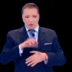 Man in suit gesturing with hands