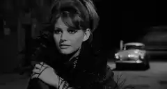 Claudia Cardinale smiles and turns away