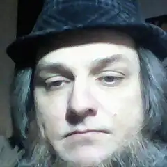 man in hat smirking
