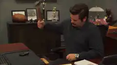 Ron Swanson smashes desk with hammer