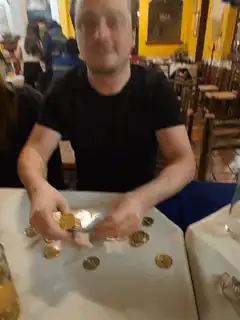 man counting coins and euro bills