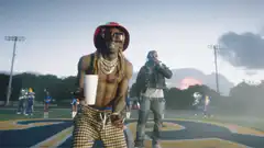 Lil Wayne dancing on a football field