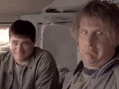 Two men in a car, one smiling one frowning
