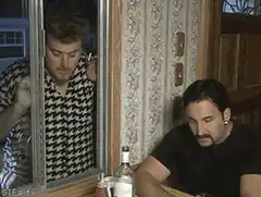 Mike Tyra pulls down blinds on window