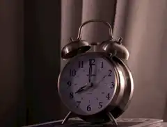 Hand smashes alarm clock