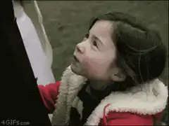 Girl in red coat smiles