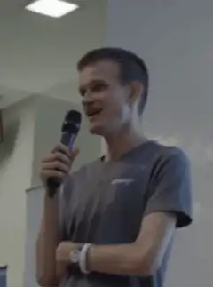 Man speaking into microphone