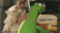 Kermit the Frog holding an umbrella