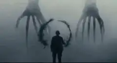 Silhouette in front of giant hands and wreath