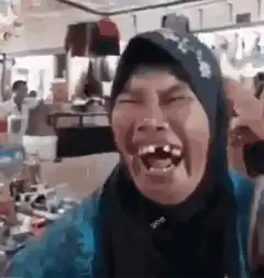 Woman laughing hysterically in store
