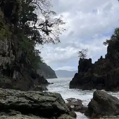 waves crashing between rocky cliffs