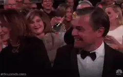Leonardo DiCaprio drinks champagne at Golden Globes