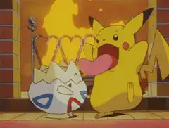Pikachu licks a crying Togepi