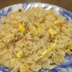 Egg fried rice on blue and white plate