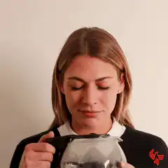 Woman drinking coffee from a pot
