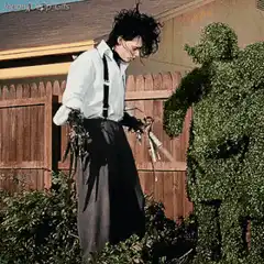 Edward Scissorhands trimming a hedge