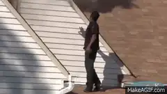 Man on roof reacts to fire