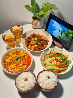 homemade chinese meal with rice and drinks