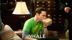 Sheldon inhaling from a box